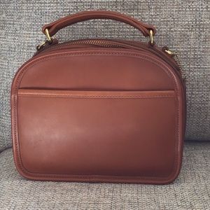 Coach domed brown small handbag.